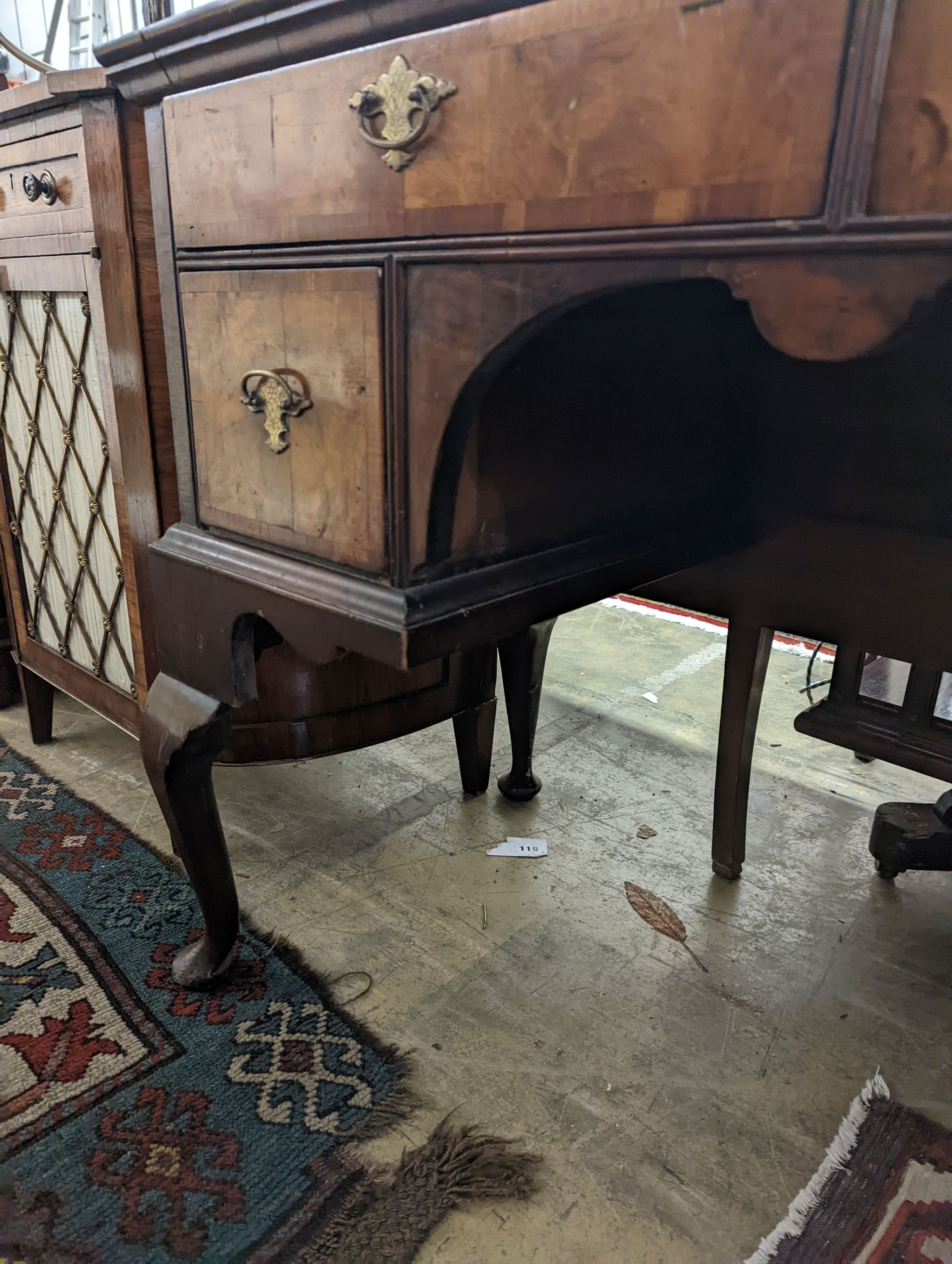 A Queen Anne revival banded walnut kneehole dressing table, width 102cm, depth 48cm, height 75cm